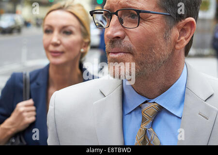 Caucasian business people walking in city, New York City, New York, United States Banque D'Images