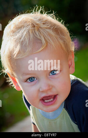 Blue Eyed boy making fun expression Banque D'Images