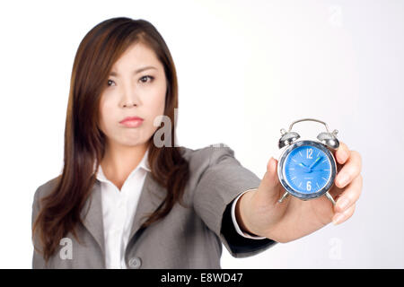 Business Woman holding réveil Banque D'Images
