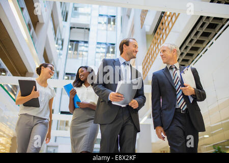 Business people walking together in office building