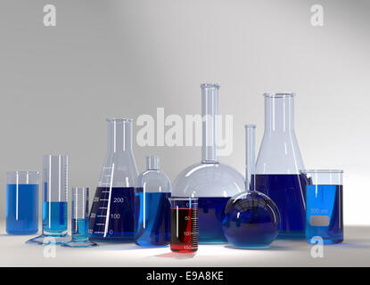 Tubes à essai avec liquide bleu et rouge. Produits chimiques de laboratoire médical ou fantaisie Banque D'Images