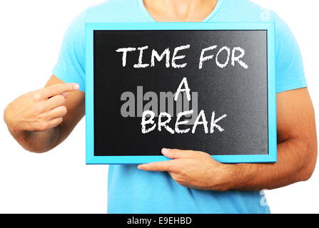 Man holding tableau noir dans les mains et en pointant le mot TEMPS DE FAIRE UNE PAUSE Banque D'Images
