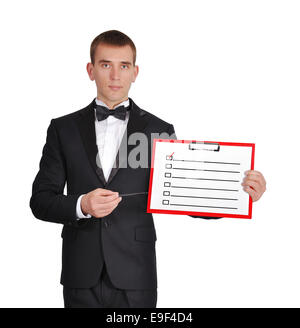 Man in tuxedo holding clipboard avec . Banque D'Images