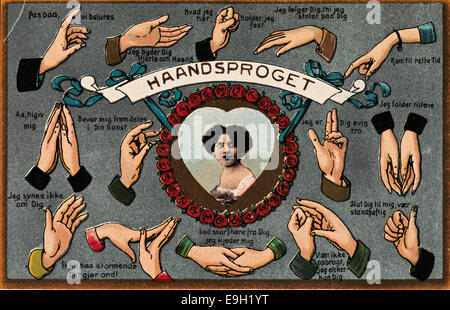 Une carte postale vintage de Saint-Valentin intitulée « langue des signes à la main, Saint-Valentin », avec des mains représentées en langue des signes à côté de cœurs. L'image célèbre l'amour et la communication le jour de la Saint-Valentin. Banque D'Images