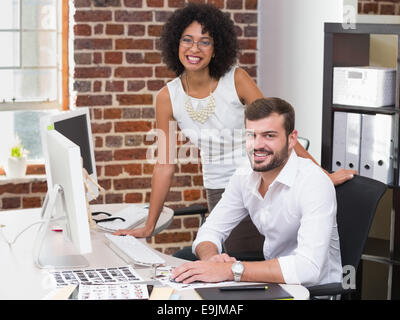 Portrait of smiling redacteurs Banque D'Images