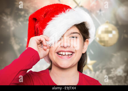 Image composite de petite fille fête smiling at camera Banque D'Images