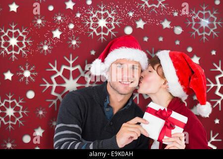 Image composite du couple holding a Christmas Gift Banque D'Images