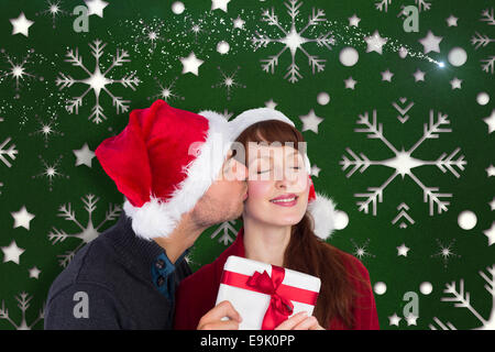 Image composite du couple holding a Christmas Gift Banque D'Images