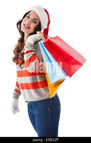 Des vêtements d'hiver en fête brunette holding shopping bags Banque D'Images