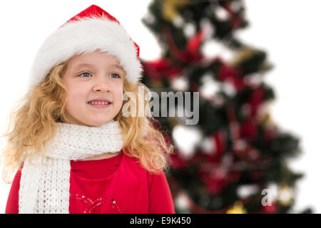 Petite fille de fête à santa hat and scarf Banque D'Images