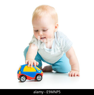 Baby Boy toddler Playing with toy car Banque D'Images