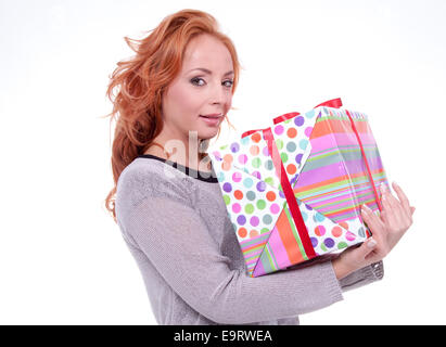 Woman holding gift box on white background Banque D'Images