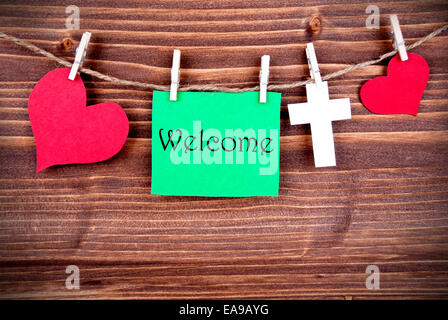 Tag vert avec des Cœurs et croix sur une ligne disant Bienvenue Banque D'Images