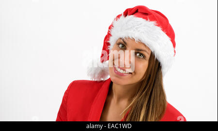 Happy young woman wearing a Santa hat rouge festif Banque D'Images