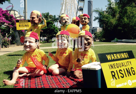 Brisbane, Australie. 14Th Nov, 2014. Les militants portent des masques représentant les différents chefs d'état et les politiciens au cours d'une action de protestation, à l'occasion du G20-sommet à Brisbane, Australie, le 14 novembre 2014. La manifestation était organisée par des groupes d'action d'attirer l'attention sur l'inégalité croissante dans le monde. PHOTO : ANDREAS LANDWEHR/dpa/Alamy Live News Banque D'Images