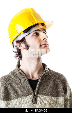 Un bel architecte ou ingénieur portent un casque et l'exécution des plans de construction. isolated on white Banque D'Images