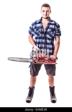 Un jeune bûcheron portant une chemise à carreaux et tenant une tronçonneuse isolated over white background Banque D'Images