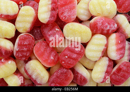 La rhubarbe et sa crème anglaise traditionnelle des bonbons durs comme une texture de fond abstrait Banque D'Images