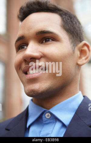 Low angle view of face de smiling man Banque D'Images