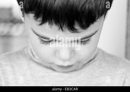 Close-up portrait of a Boy looking down Banque D'Images