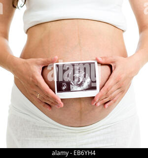 Pregnant woman holding ultrasound sonogramme de bébé à venir Banque D'Images