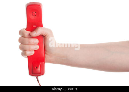 Récepteur téléphonique rouge dans la main isolé sur fond blanc Banque D'Images
