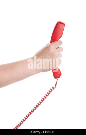 Récepteur téléphonique rouge dans la main isolé sur fond blanc Banque D'Images