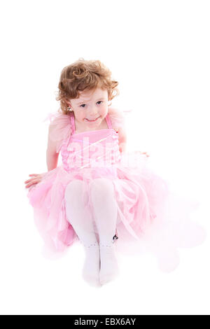 Jolie fille aux cheveux bouclés dans little fairy dress Banque D'Images