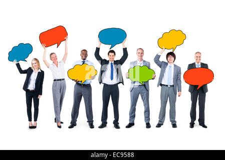 Business People Holding Speech Bubbles Banque D'Images