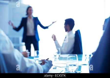 Young businesswoman standing in conference room giving presentation Banque D'Images