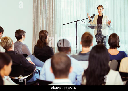Businesswoman giving presentation in conference room Banque D'Images