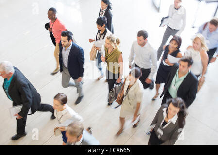 High angle view of business people walking in office Banque D'Images