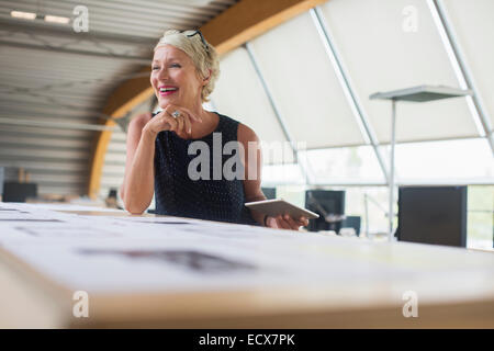Businesswoman using digital tablet in office Banque D'Images