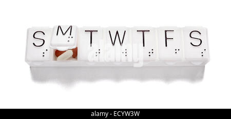 Boîte à pilules photographiée sur un fond blanc Banque D'Images