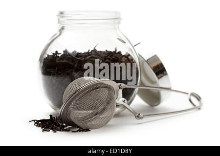 Contenant en verre avec plateau et une passoire du thé Banque D'Images