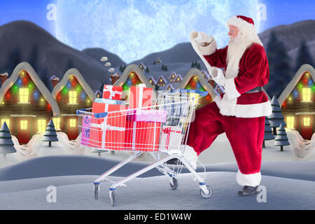 Image composite de santa offrant des cadeaux de panier Banque D'Images