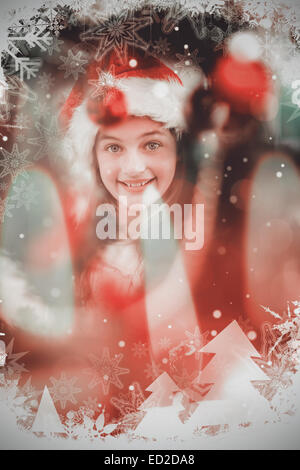 Image composite de litte festive girl decorating Christmas Tree Banque D'Images