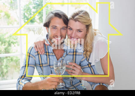 Image composite de cute smiling couple enjoying white wine Banque D'Images