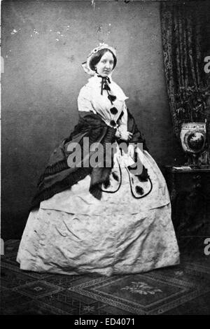 Dame victorienne C.1880 s portant une robe de style animation Banque D'Images