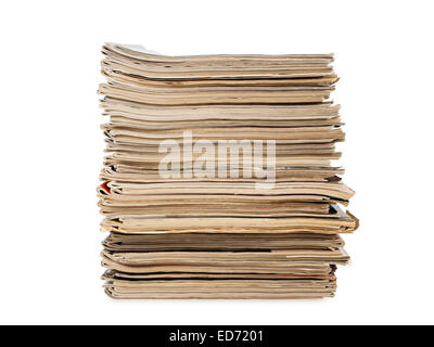 Une pile de vieux magazines jaune isolated on white background, studio shot Banque D'Images