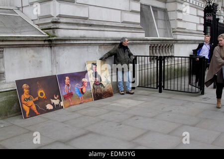 Westminster London,UK. 7e janvier 2015. Peintures satiriques affichés par artiste Kaya Mar de la réunion entre Angela Merkel à Downing Street London Crédit : amer ghazzal/Alamy Live News Banque D'Images