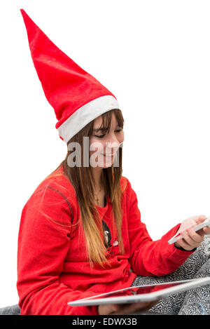 Jeune femme ayant l'amusement avec un téléphone et une tablette Banque D'Images