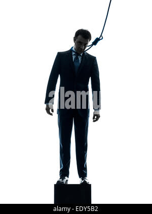 Un homme suicidaire business man hanging in silhouette studio isolé sur fond blanc Banque D'Images