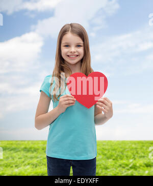 Smiling little Girl with red heart Banque D'Images