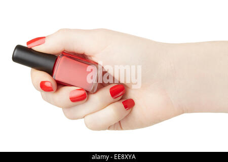 La main féminine avec bouteille de vernis à ongles rouge Banque D'Images