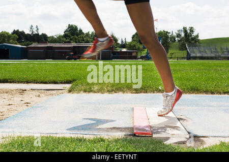 Femme long jump Banque D'Images