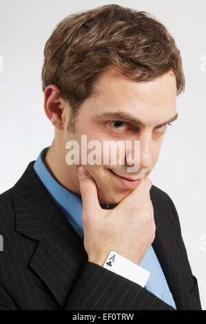 Businessman avec une carte dans sa manche Banque D'Images