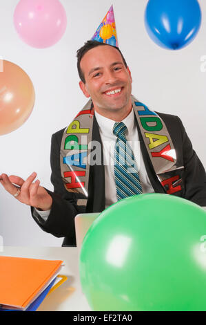 Businessman at a Birthday celebration Banque D'Images