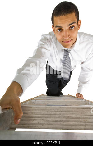 Businessman climbing ladder Banque D'Images