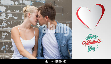 Image composite du hip young couple sitting on steps kissing Banque D'Images